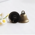 Macro shot of vintage bronze bell ornaments with aged texture on a white background - 38MM