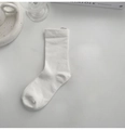 Minimalist white pure cotton crew sock for women laid flat on a clean white desk surface - White