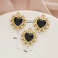 Macro detail of 23x20mm black heart pendant with gold thorny edge and pearl border - 529# Gold - Black Zirconia