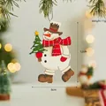 Cartoon snowman wooden Christmas tree ornament with brown hat and red striped scarf - Snowman