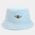 Detail of light blue bucket hat featuring fine bee embroidery and breathable cotton fabric - One Size / Light Blue