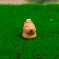 Cute brown resin capybara figurine with a white towel on head for desk decor - No. 6 Bathing Style
