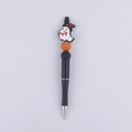 Halloween beaded pen with white ghost topper and orange bead accents on a black barrel - Ghost Wizard