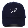 Navy blue cotton baseball cap with white bow ribbon embroidery shown on white background - Navy Blue