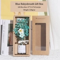 Blue dried gypsophila flower bouquet in glass vase inside a windowed gift box - Blue Baby's Breath