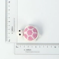 Pink and white handmade crochet turtle keychain charm with measuring rulers showing size - Pink and White Crochet Turtle