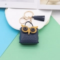 Navy blue owl faux leather coin purse keychain with tassel on a white display tray - Navy Blue