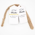Close-up of white paper gift tags with Danke text, decorative wave edges and hemp ropes - 4-White Danke German