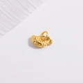 Macro view of a detailed golden fish pendant charm for DIY jewelry and bracelets - Koi Fish / Gold
