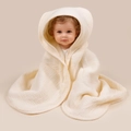 Close-up of the soft crinkle texture on a hooded cotton gauze baby bath towel - Off White