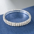 Macro detail of a double-row silver elastic bracelet featuring clear sparkling rhinestones - 2 Rows / Silver