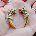 Wolf head tooth pendant in antique bronze finish with double-sided relief carving - Antique Bronze Metal Wolf Tooth