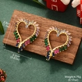 Detail showing heart earrings size 2.8cm by 2.2cm with colorful cubic zirconia stones - Gold Heart Multicolor Zirconia Hoop Earrings