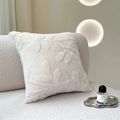 Cream white faux fur throw pillow with embossed floral leaf pattern on a sofa - White Cut Velvet Branch