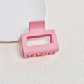 Close-up of matte pink rectangular hollow hair claw clip on white fabric surface - Matte Pink Small Square Claw Clip (2#)