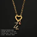 Elegant golden titanium steel heart clasp necklace with initial pendant and pink gemstone - Letter U
