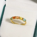 Macro shot of an adjustable gold ring with five colorful round gemstones on velvet - Five-Color Round Cabochon Gemstone Vintage Style (金色24)
