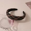 Close-up of vintage plaid headband in deep green and red fabric on a glass plate - Dark Green Red Plaid