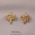 Golden fan-shaped stainless steel earrings with white faux pearls and feather texture - Stainless Steel Pearl Feather Dangle