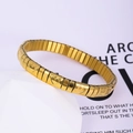 Detail shot of golden stretch bracelet featuring heart cutouts and modular link design - k0203-Gold Hollow Heart