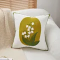 White lily of the valley throw pillow with green piped edges and tufted floral embroidery - Lily of the Valley