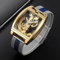 Detailed close-up of a golden square skeleton watch with blue-silver mesh strap - Gold Case Silver and Blue Mesh Strap