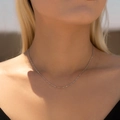 Minimalist S925 sterling silver snake bone chain necklace shown on a model neck - 925 Silver / Shimmering Sequin Chain
