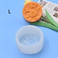 Close-up of silicone mold and round orange candle with 3D floral bird relief details - Size L / Flower and Bird Pattern