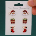 Christmas earring set featuring Santa Claus, gift box, and stocking studs on a card - Santa Claus/Gift Box/Christmas Sock 3-Pair Set (KC Gold 3494)