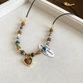Macro shot of heart-shaped tiger eye stone pendant with colorful beads on grey velvet tray - 53# Coffee Heart Pendant Beaded Necklace