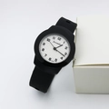 Detailed macro view of quartz watch with black silicone strap and white textured dial - Black