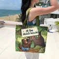 Green canvas tote bag with forest mole illustration and At the Mole's house text - Squirrel Tree