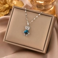 Exquisite Silberkette mit sternblauem Kugelanhänger und diamantbesetztem Bär - Silber Sternenbär