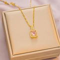 Elegant gold necklace featuring a rectangular pink gemstone pendant with halo diamonds - 6041 Rectangle Pink Zircon / Gold Pink Zircon
