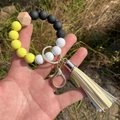 Handheld silicone bead bracelet keychain with leopard prints, yellow tassel and metal clasp - Yellow