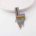 Detail of L-shaped brooch with colorful woven stripes and sparkling rhinestone tassels - L