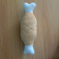 Brown and white bone-shaped plush dog toy with cross-stitch pattern on wood background - Chicken Leg