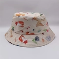 Detail of forest animal print on cotton bucket hat featuring fox and deer motifs - Beige Forest Animals