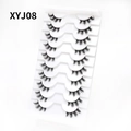 Close-up of 10 pairs of cat-eye false eyelashes XYJ08 on a white display tray - Curled Voluminous Style (XYJ08) / 10 Pairs Set