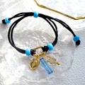 Detail of black braided DIY bracelet featuring light blue beads and rose embossed pendants - Black Woven Rope Blue Strip Rose Charm Bracelet