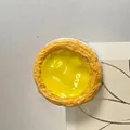 Realistic egg tart fridge magnet with golden custard and silver foil baking cup - Egg Tart