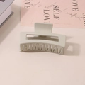 Matte light beige rectangular hair claw clip for thick hair shown on a minimalist table - #11 Matte Warm Gray - 8.5cm / Bulk (No Packaging)