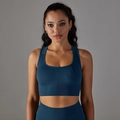 Detail of dark blue seamless sports bra showing breathable knit texture and high neckline - Navy Blue