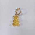 Gold hoop earrings featuring a translucent amber gummy bear charm and micro-pavé crystals - Transparent Yellow