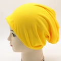 Vibrant yellow slouchy knit beanie cap shown on head mannequin in a side profile view - Adjustable / Yellow