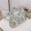 Close-up of floral canvas toiletry bag with silver zipper and simple wish label - Pink Flower with Green Leaf