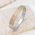 Three-tone woven titanium steel bangle with silver gold and rose gold star accents - Wave