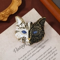 Vintage cat brooch in black and white enamel with blue rhinestone eyes and gold trim - Japanese Style Painted Big Face Cat / Black And White