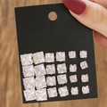 Set of 12 pairs of square cubic zirconia stud earrings with golden finish on black card - 12 Pairs Gold Square Clear Gem Set (E1785-1)