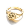 Macro shot of gold signet ring featuring celestial female portrait with star and moon motifs - Vintage Portrait Signet